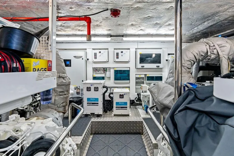Slide: The Image of Engine room of 2026 Sunseeker 88 Yacht with advanced equipment and control panels. - 104