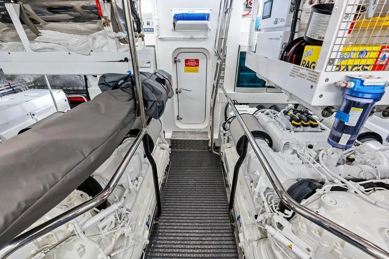 Slide: The Image of Engine room of 2026 Sunseeker 88 Yacht, featuring dual engines and maintenance equipment. - 108