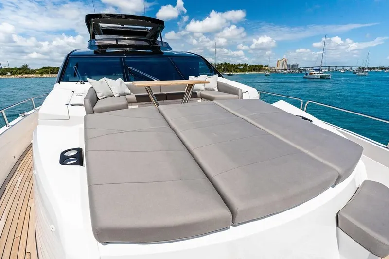 Slide: The Image of Luxurious 2026 Sunseeker 88 Yacht with spacious sunbathing deck on tranquil blue waters. - 11
