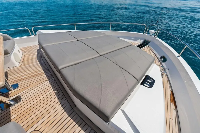Slide: The Image of Luxurious Sunseeker 88 Yacht 2026 deck with sunbeds and ocean view. - 12