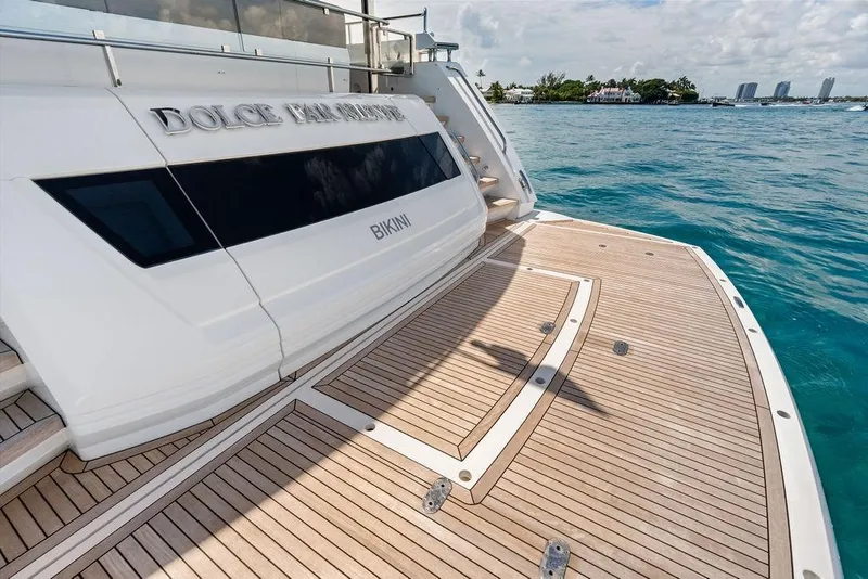 Slide: The Image of Luxury Sunseeker 88 Yacht 2026, wooden deck, ocean view, elegant design. - 16