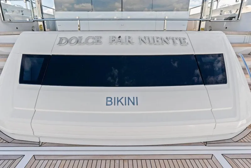 Slide: The Image of Sunseeker 88 Yacht 2026, rear view with "Dolce Far Niente" and "Bikini" text. - 17