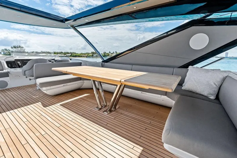 Slide: The Image of Luxurious Sunseeker 88 Yacht 2026 interior with sleek seating and elegant wooden table. - 22