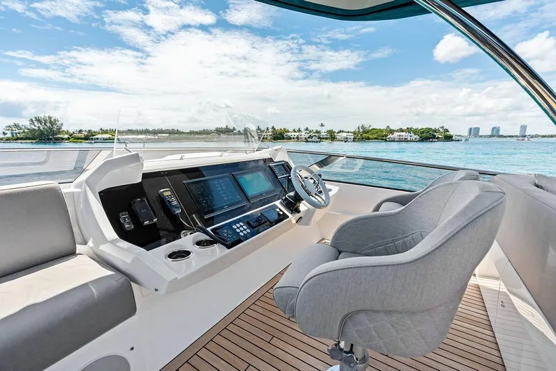 Slide: The Image of Luxurious 2026 Sunseeker 88 Yacht helm with modern controls and ocean view. - 27
