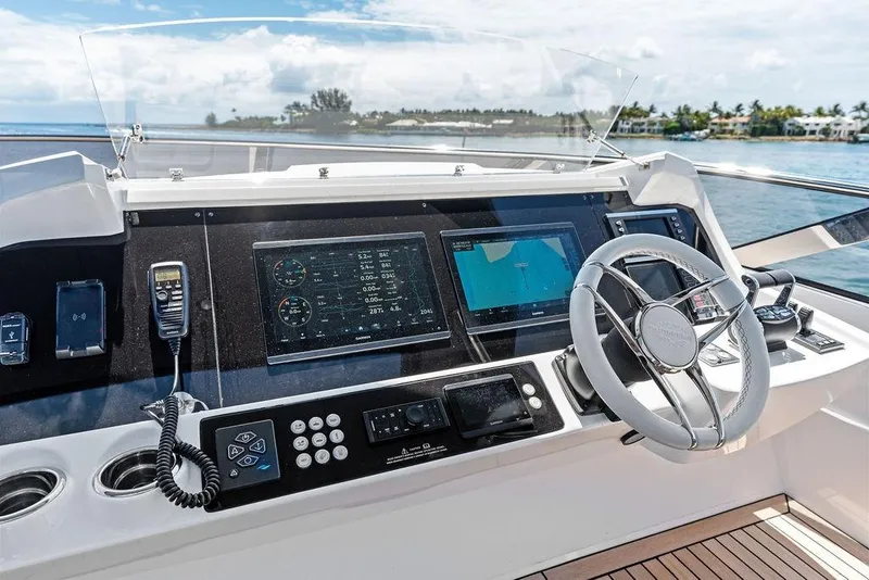 Slide: The Image of Helm of 2026 Sunseeker 88 Yacht with advanced navigation systems and luxurious design. - 28
