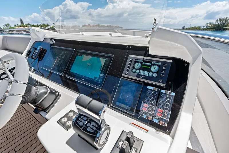 Slide: The Image of Helm of 2026 Sunseeker 88 Yacht with advanced navigation systems and controls. - 29