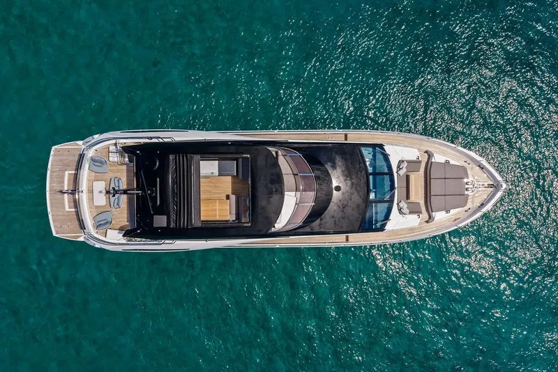 Slide: The Image of Aerial view of 2026 Sunseeker 88 Yacht on clear blue water. - 4