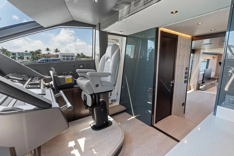Slide: The Image of Luxurious interior of 2026 Sunseeker 88 Yacht, featuring modern helm and spacious living area. - 49