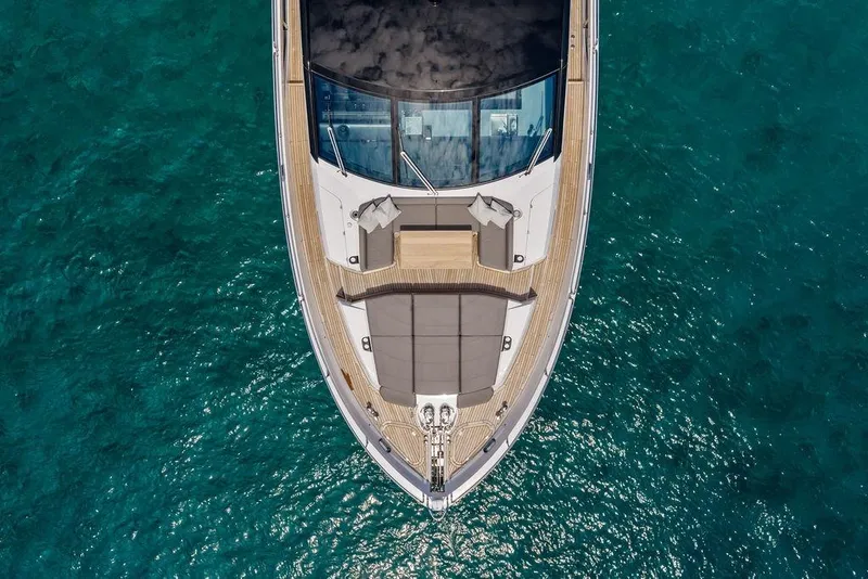 Slide: The Image of Aerial view of 2026 Sunseeker 88 Yacht on clear blue water. - 5