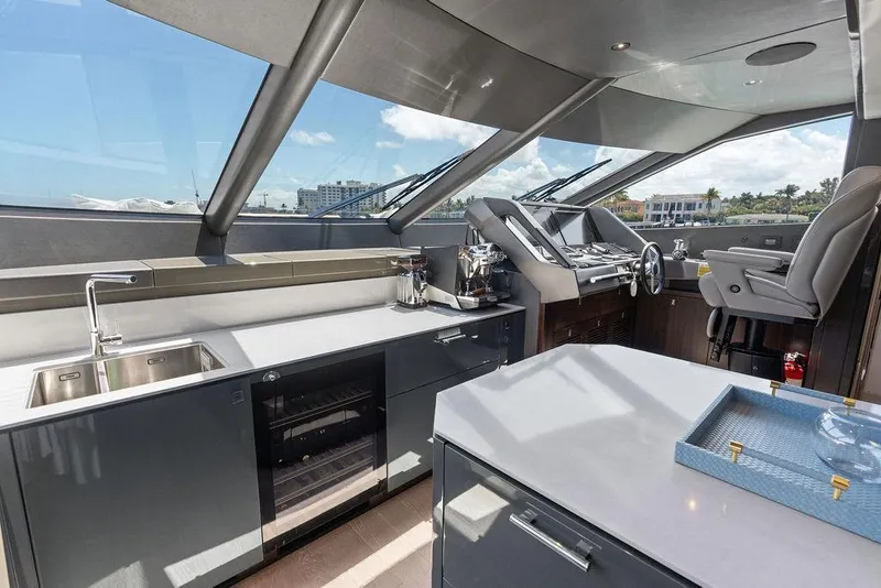 Slide: The Image of Luxurious interior of 2026 Sunseeker 88 Yacht with modern kitchen and helm station. - 50