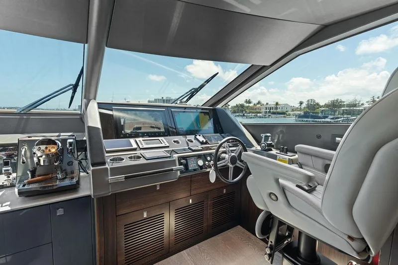 Slide: The Image of Cockpit of 2026 Sunseeker 88 Yacht with modern controls and luxurious seating. - 51