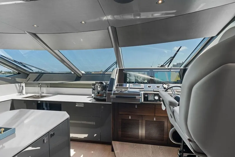 Slide: The Image of Luxurious helm of 2026 Sunseeker 88 Yacht with modern controls and panoramic windows. - 53