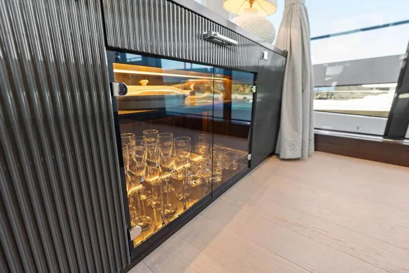 Slide: The Image of Luxurious interior of 2026 Sunseeker 88 Yacht with glass cabinet and elegant decor. - 57
