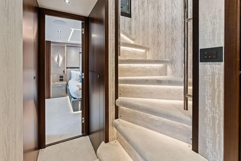 Slide: The Image of Luxurious interior of 2026 Sunseeker 88 Yacht with elegant staircase and bedroom view. - 59
