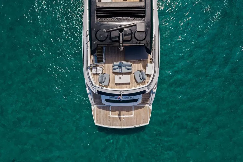 Slide: The Image of Top view of 2026 Sunseeker 88 Yacht on clear turquoise water. - 6