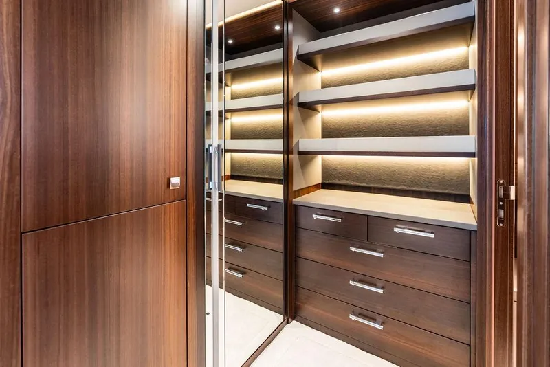 Slide: The Image of Luxurious wooden cabinetry with ambient lighting on the 2026 Sunseeker 88 Yacht. - 69