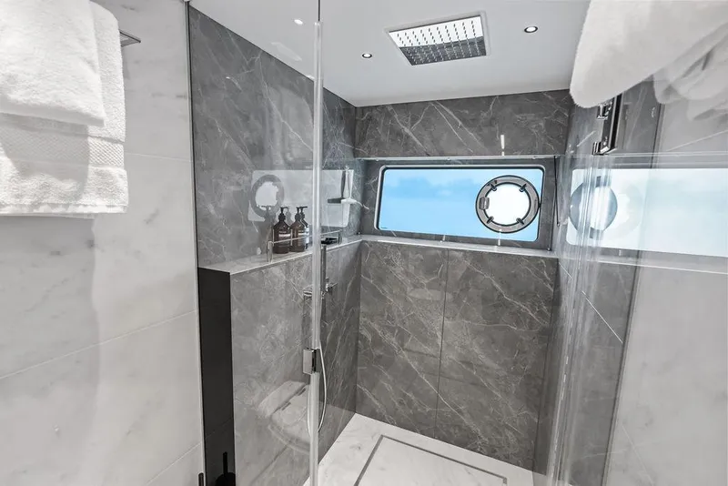 Slide: The Image of Luxurious bathroom in 2026 Sunseeker 88 Yacht with marble walls and ocean-view window. - 73