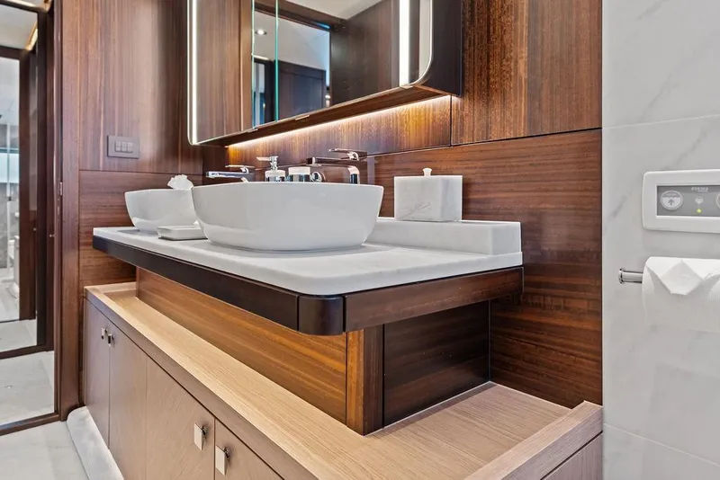 Slide: The Image of Luxurious bathroom interior of 2026 Sunseeker 88 Yacht with modern fixtures and elegant wood finishes. - 75