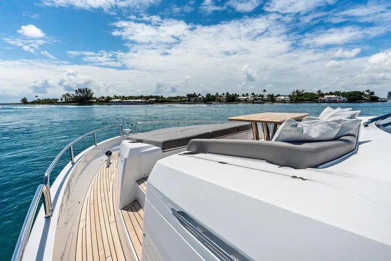 Slide: The Image of Luxurious Sunseeker 88 Yacht 2026 cruising on serene waters under a clear blue sky. - 8