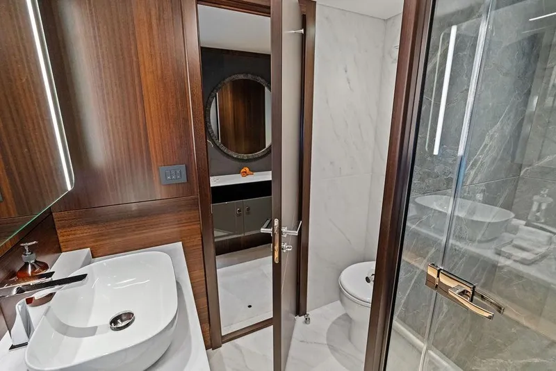 Slide: The Image of Luxurious bathroom interior of 2026 Sunseeker 88 Yacht with modern fixtures and elegant design. - 82