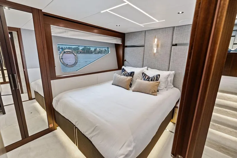 Slide: The Image of Luxurious bedroom interior of 2026 Sunseeker 88 Yacht with elegant design and scenic window view. - 85