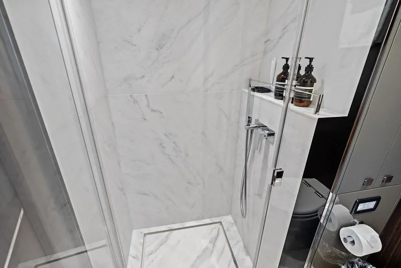 Slide: The Image of Luxurious marble bathroom in 2026 Sunseeker 88 Yacht with modern shower amenities. - 88