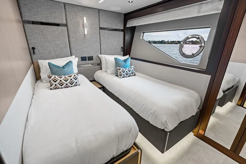Slide: The Image of Luxurious twin bedroom on 2026 Sunseeker 88 Yacht with modern decor and ocean view. - 89