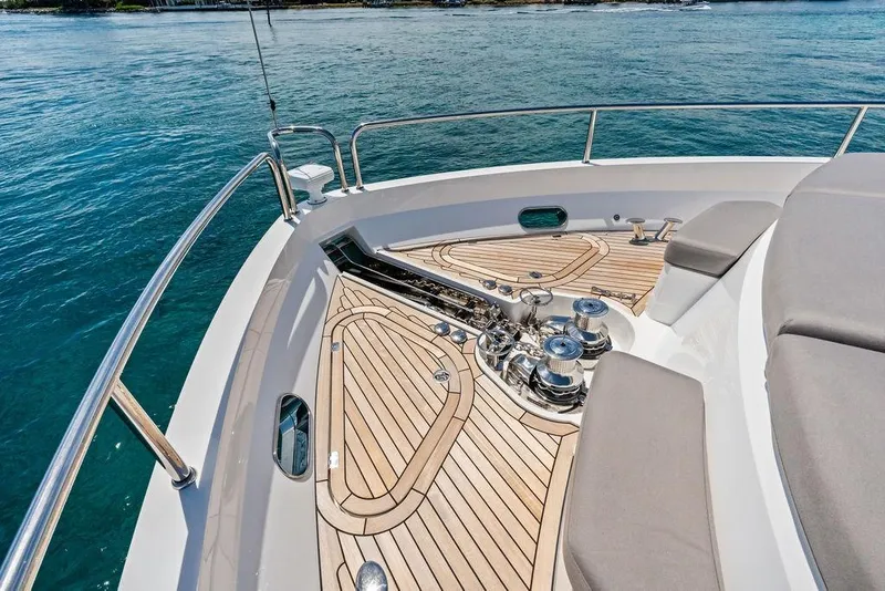 Slide: The Image of Sunseeker 88 Yacht 2026 bow with teak deck and ocean view. - 9