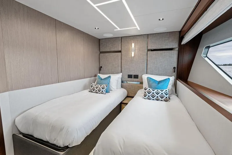 Slide: The Image of Luxurious twin bedroom in 2026 Sunseeker 88 Yacht with modern decor and ocean view. - 90