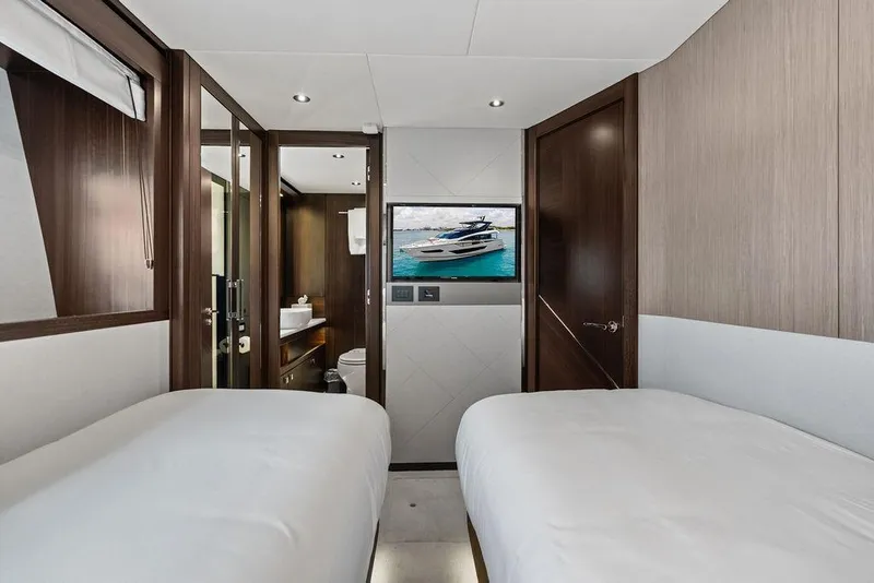 Slide: The Image of Luxurious interior of 2026 Sunseeker 88 Yacht with twin beds and modern amenities. - 91