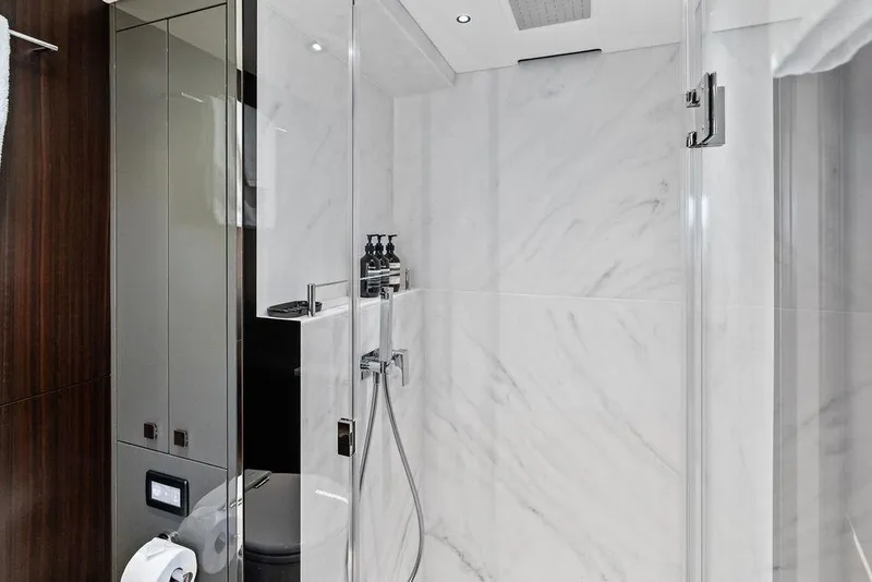 Slide: The Image of Luxurious bathroom in 2026 Sunseeker 88 Yacht with marble walls and modern fixtures. - 93