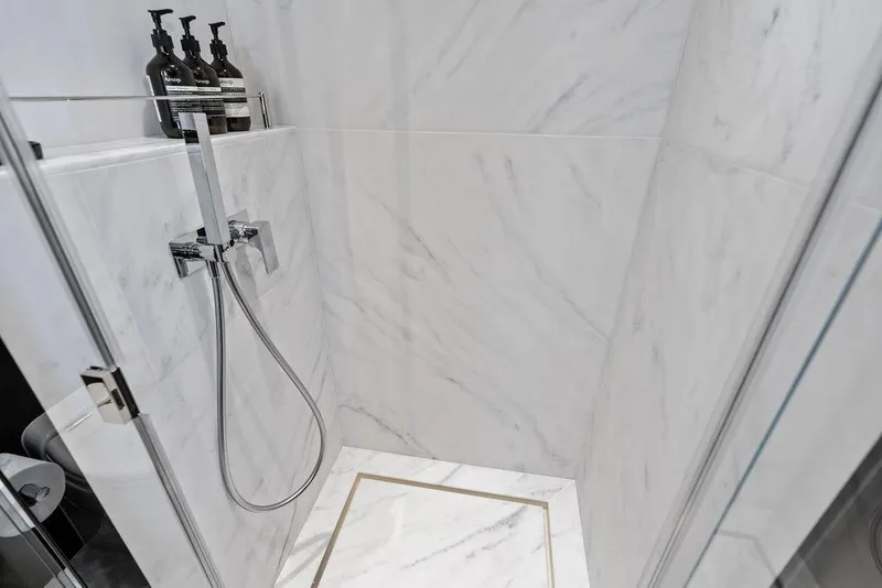 Slide: The Image of Luxurious marble shower in 2026 Sunseeker 88 Yacht bathroom. - 94