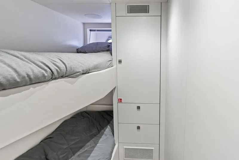 Slide: The Image of Bunk beds in the 2026 Sunseeker 88 Yacht cabin, featuring sleek modern design. - 96