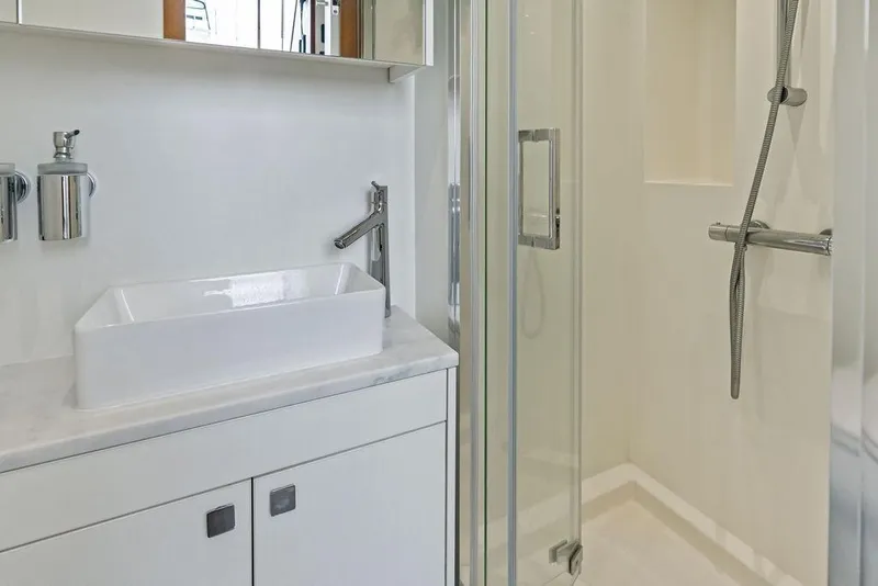 Slide: The Image of Modern bathroom on 2026 Sunseeker 88 Yacht with sleek sink and glass shower. - 97