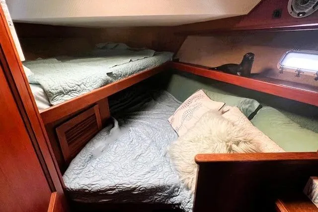 Slide: The Image of Cozy cabin interior of 1980 Viking 43 Convertible yacht with plush bedding. - 17