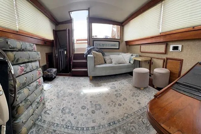 Slide: The Image of Interior of a 1980 Viking 43 Convertible yacht with cozy seating and elegant decor. - 23