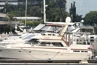 Slide: The Image of 1980 Viking 43 Convertible yacht being lifted for maintenance at a marina. - 8