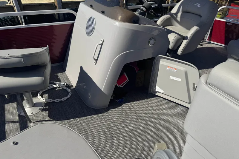 Slide: The Image of 2023 Bennington 188 SVF boat interior with open storage compartment and seating. - 12