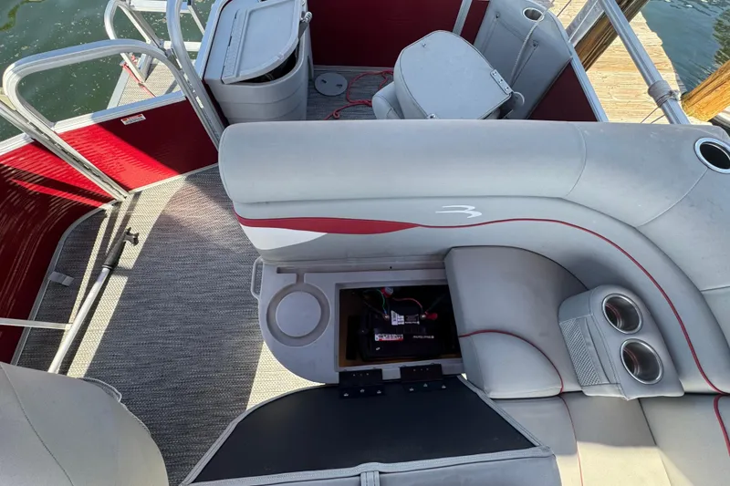 Slide: The Image of 2023 Bennington 188 SVF pontoon boat interior with seating and storage compartments. - 5