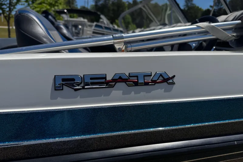 Slide: The Image of 2018 Ranger 212LS Reata boat logo on sleek exterior design. - 2