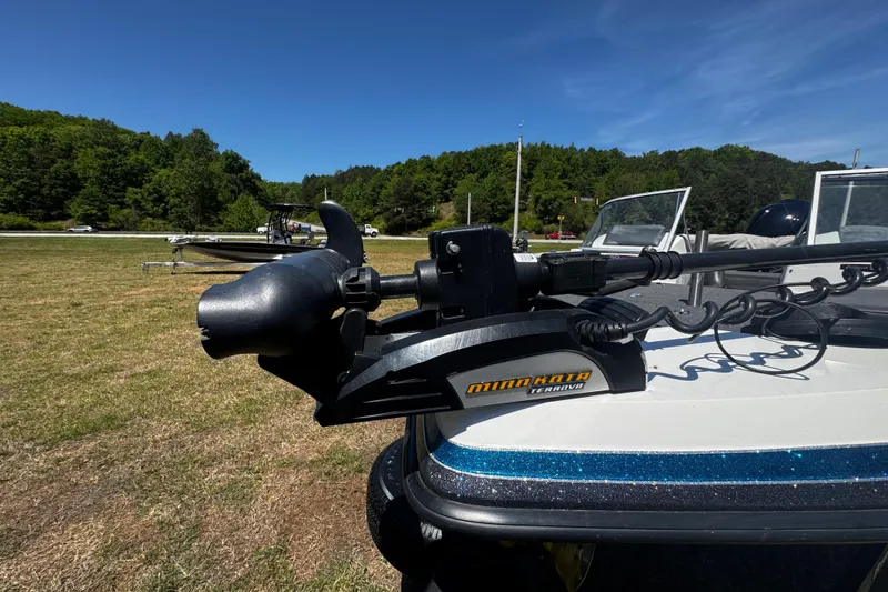 Slide: The Image of 2018 Ranger 212LS Reata boat with Minn Kota Terrova motor on grassy area. - 5