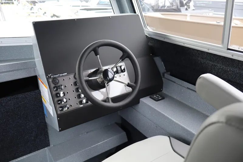 Slide: The Image of Steering console of 2026 KingFisher 2825 Coastal Express boat interior. - 13