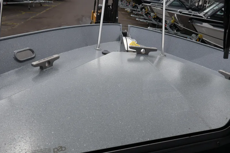 Slide: The Image of Bow view of 2026 KingFisher 2825 Coastal Express boat, showcasing deck and cleats. - 15