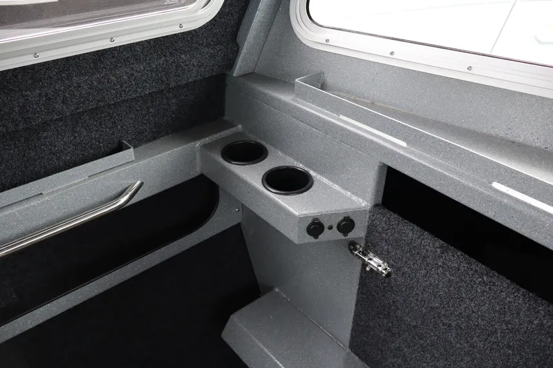 Slide: The Image of Interior of 2026 KingFisher 2825 Coastal Express boat with cup holders and storage. - 17