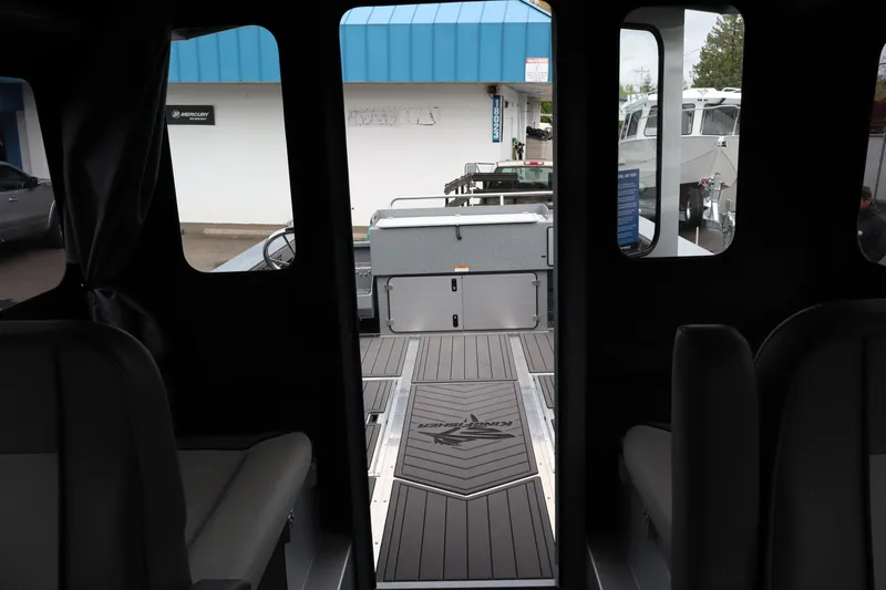 Slide: The Image of Interior view of 2026 KingFisher 2825 Coastal Express boat, showcasing seating and deck design. - 20
