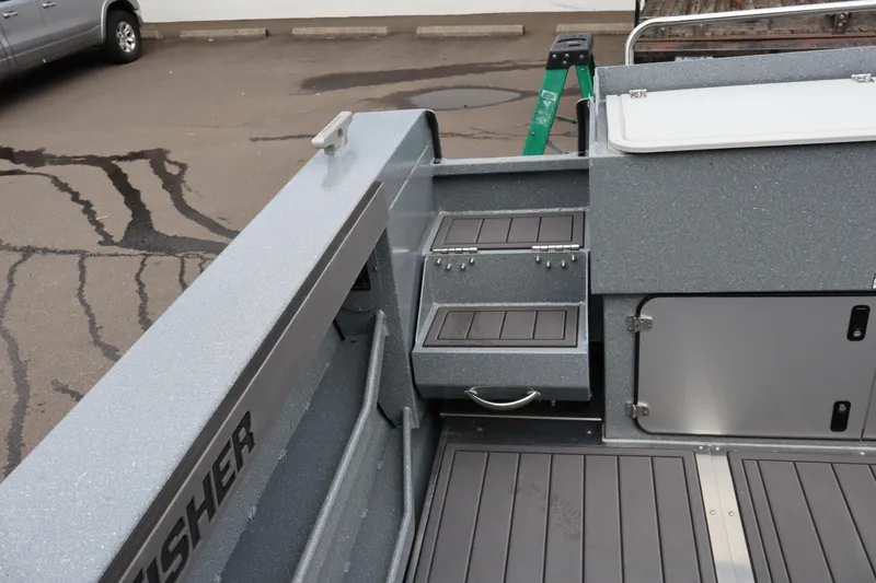 Slide: The Image of Interior view of 2026 KingFisher 2825 Coastal Express boat, showcasing storage compartments. - 21