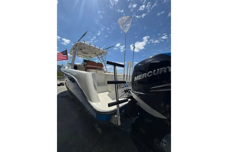 Slide: The Image of 2006 Hydra-Sports Vector 3300 VX boat with Mercury engine under clear blue sky. - 10