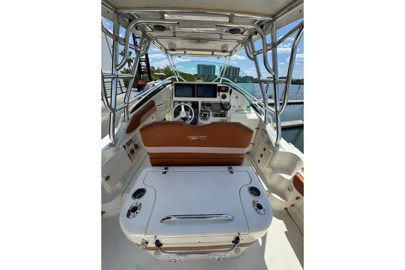 Slide: The Image of 2006 Hydra-Sports Vector 3300 VX boat interior with helm and seating area. - 12