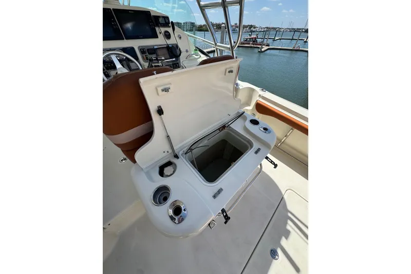 Slide: The Image of 2006 Hydra-Sports Vector 3300 VX boat interior with open storage compartment and control panel. - 15