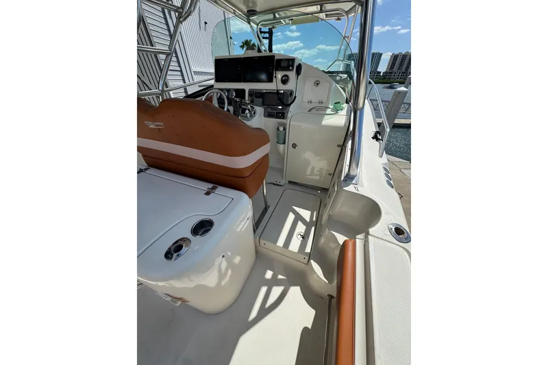 Slide: The Image of 2006 Hydra-Sports Vector 3300 VX boat interior with helm and seating area. - 16